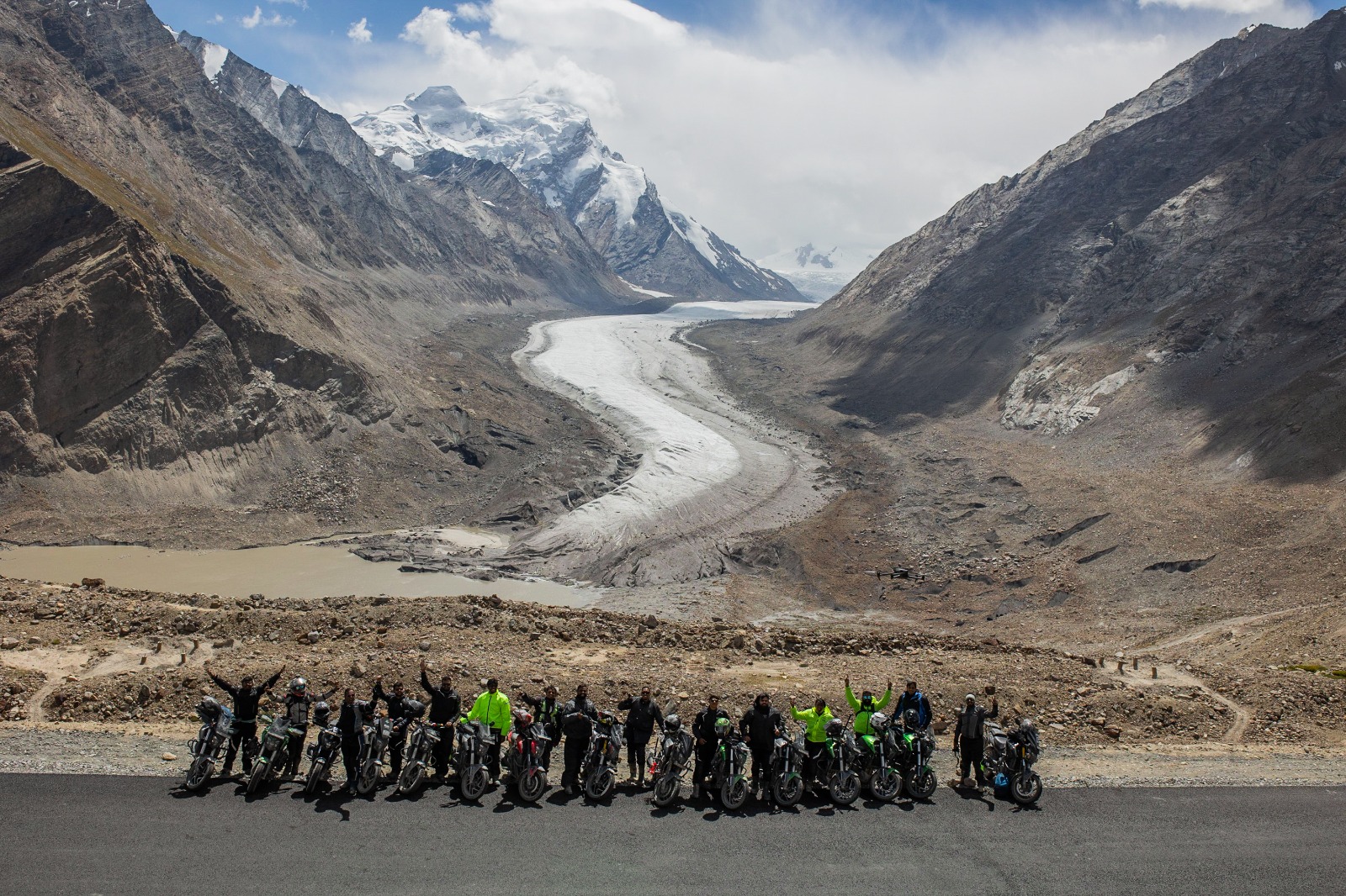 Group of bikers at a mountain glacier